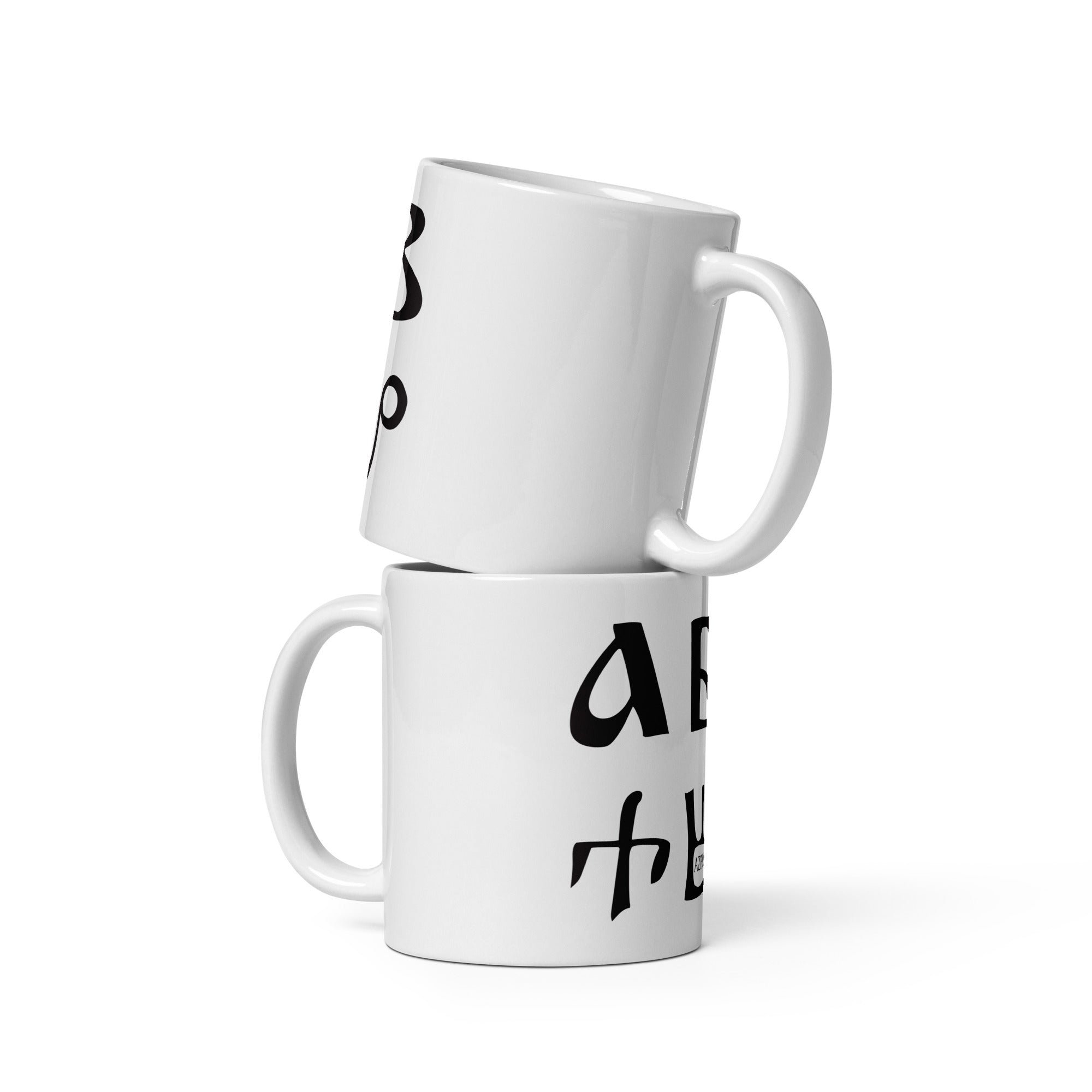 Mocukup of Bulgarian azbuka - alphabet - on two white ceramic mugs.