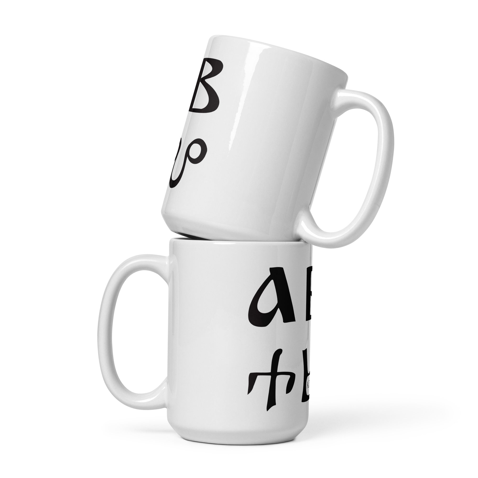 Mocukup of Bulgarian azbuka - alphabet - on two white ceramic mugs.