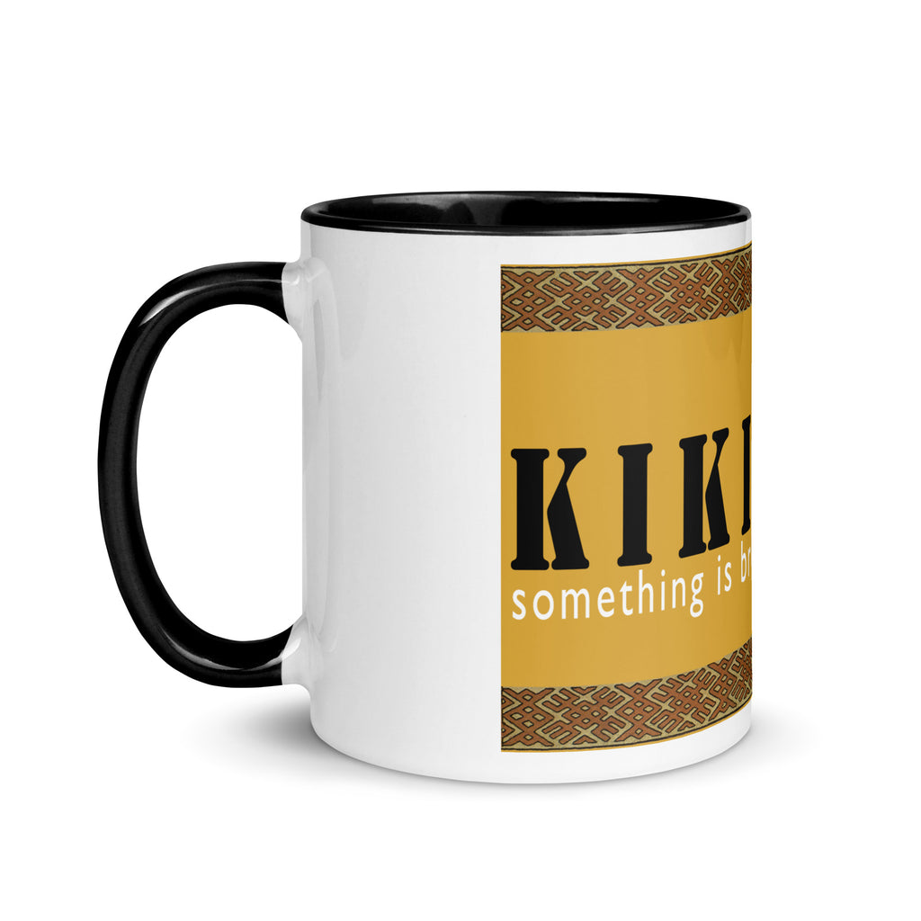 White ceramic mugs with color inside and saying "Kikimora Something is brewing." Referencing the Slavic folklore tales that the swamp creature brews beer.