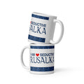 A white ceramic mug with the saying "I am a seductive rusalka," a Slavic water spirit, often called a mermaid.