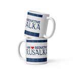 A white ceramic mug with the saying "I am a seductive rusalka," a Slavic water spirit, often called a mermaid.